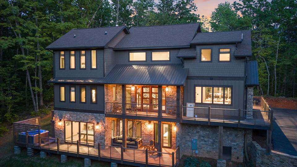 Bougie Bear Chalet illuminated at twilight among the trees